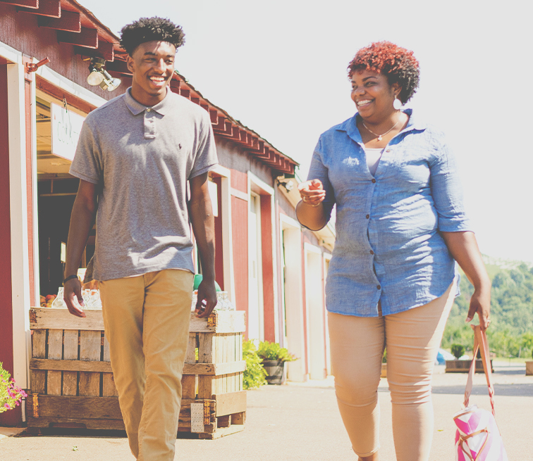 Mom and son walking and smiling